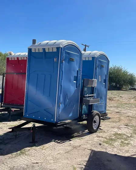 Porta potty trailer with built-in hand sinks
